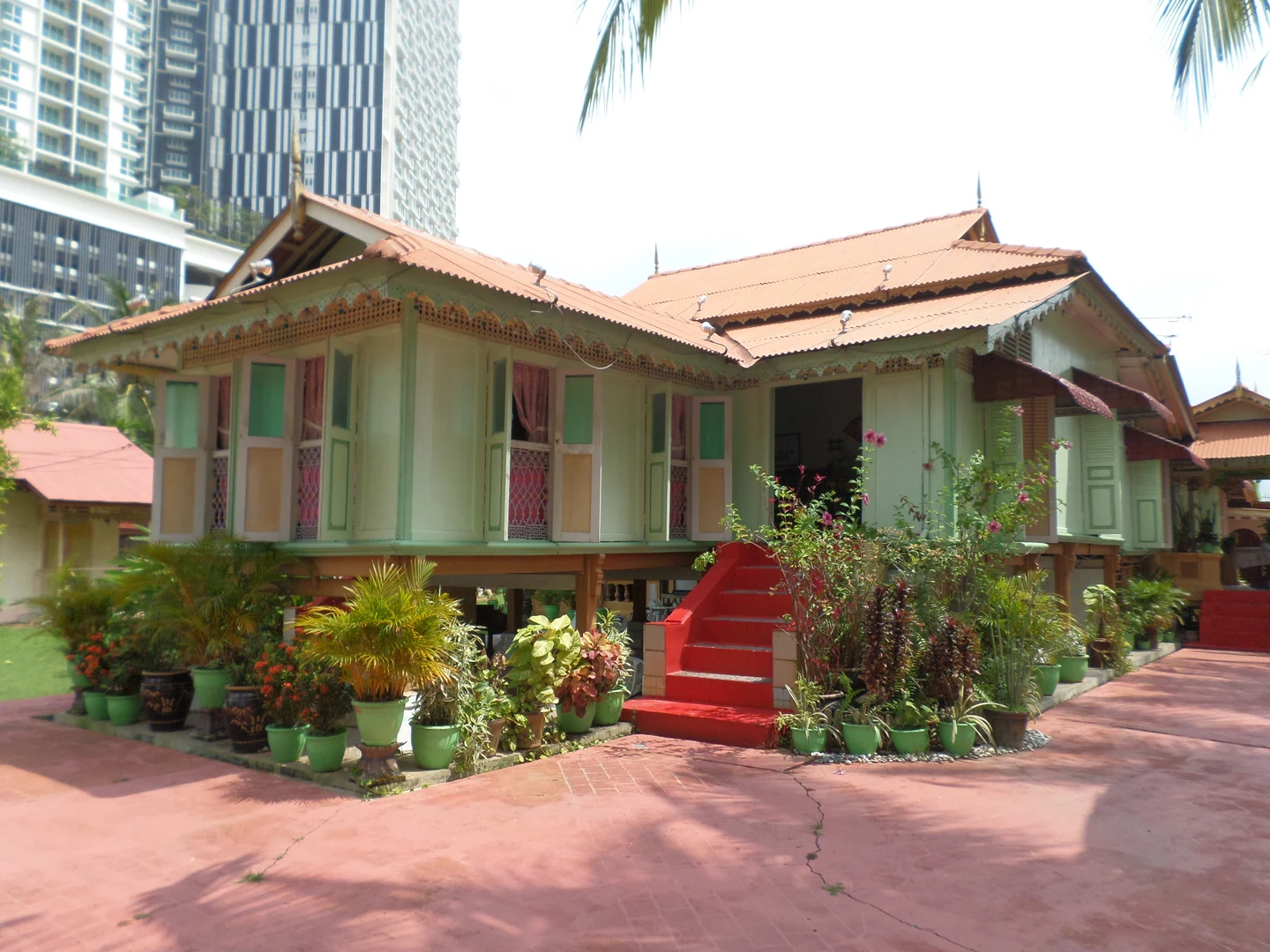 Villa Sentosa's raised timber house and red steps, photographed by Chongkian in 2015